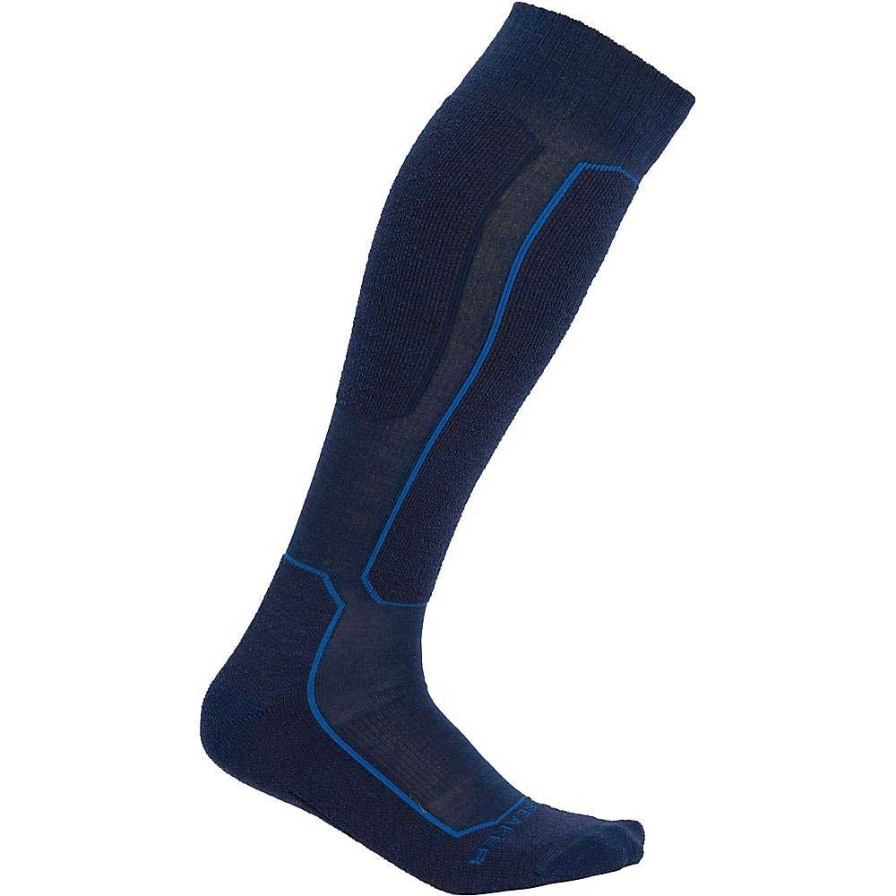 The Icebreaker Mens Ski+ Light Over The Calf Sock is a single navy blue ski sock featuring light blue geometric lines along the side, ankle, and foot areas.