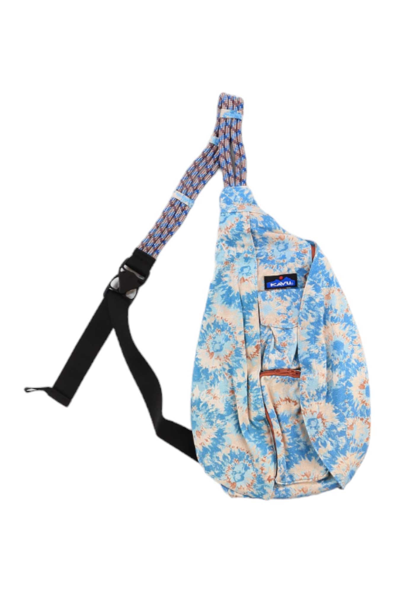 The KAVU Womens Rope Bag is a blue and peach floral-patterned travel bag with a black adjustable rope shoulder strap, zippered pockets, and a small rectangular logo patch on the front.