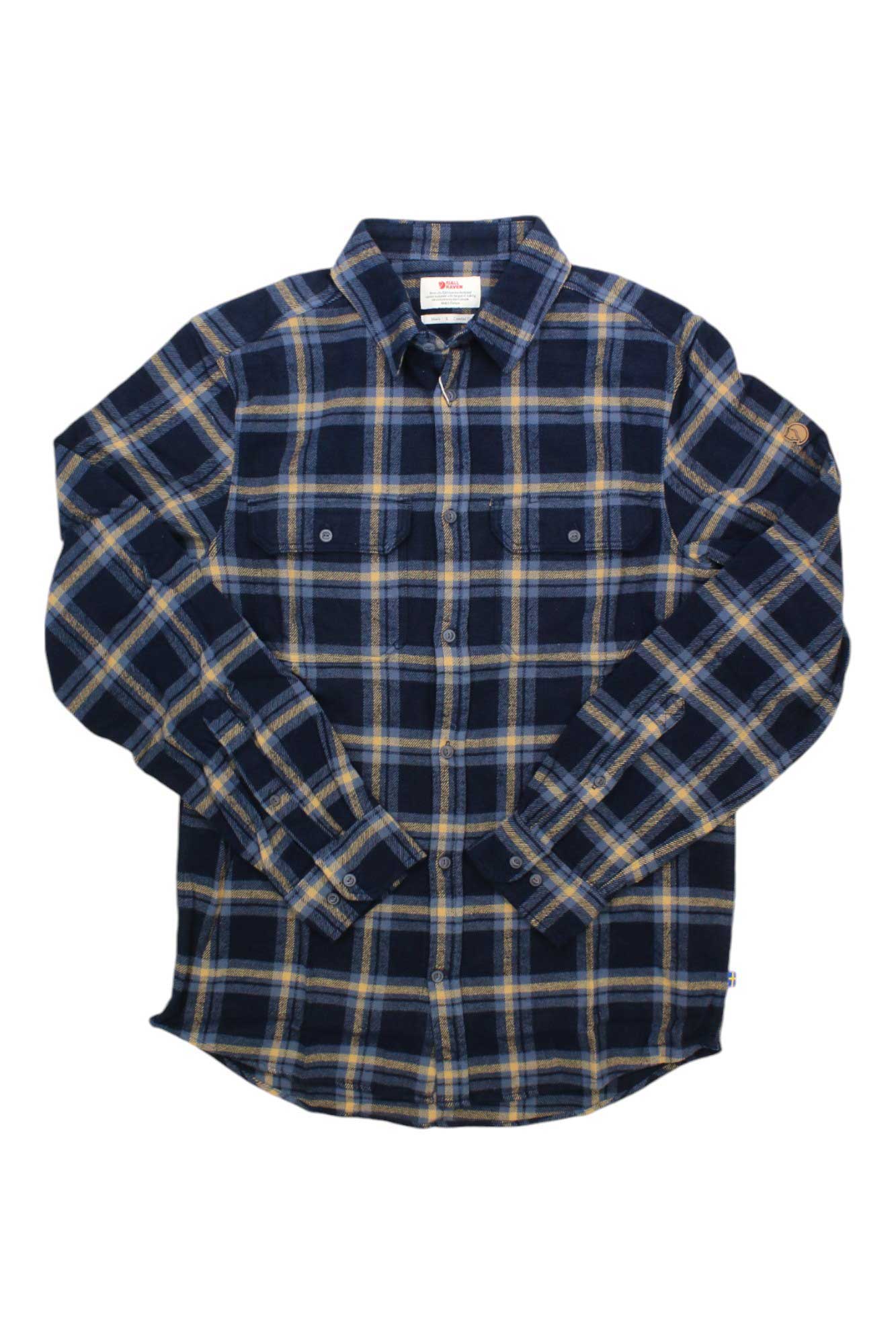 The Fjallraven Mens Ovik Heavy Flannel Shirt, made from organic cotton with long sleeves, blue/black/yellow plaid, two chest pockets and a collar, is shown laid flat on a white background.