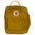 Mustard Kanken backpack with front flap pocket, zip, and tan webbing carry handles
