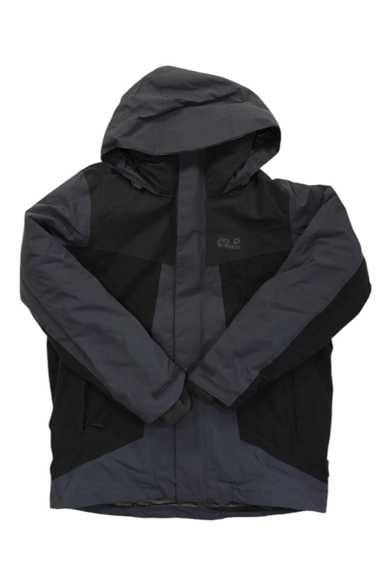 The Jack Wolfskin Men's Apex Trail 3in1 Jacket is a dark gray and black insulated outdoor jacket with a hood, zip front, and long sleeves, shown on a white background. It features a sporty design ideal for winter wear.