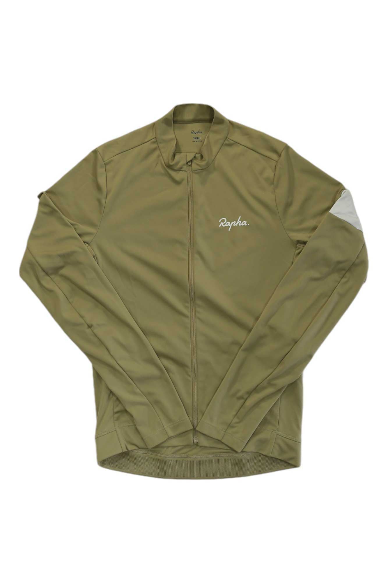 The Rapha Mens Core Long Sleeve Jersey in olive green features a full front zipper, high collar, moisture-wicking fabric, a small white Rapha logo on the chest, and a white patch detail on the left sleeve.