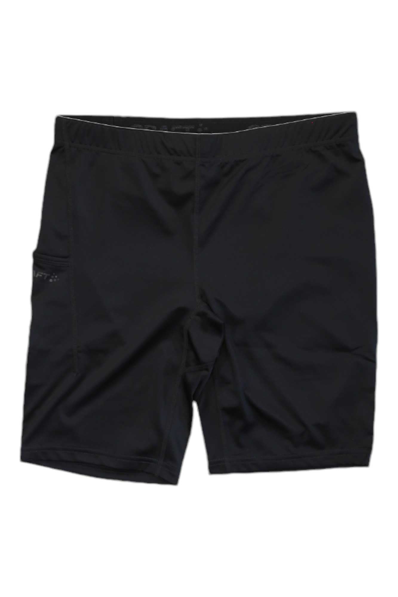 The Craft Sportswear Mens ADV Essence Short Tight is a black gym short with a fitted waistband and subtle side pocket, shown flat on a white background. These moisture-wicking shorts are ideal for intense training sessions.