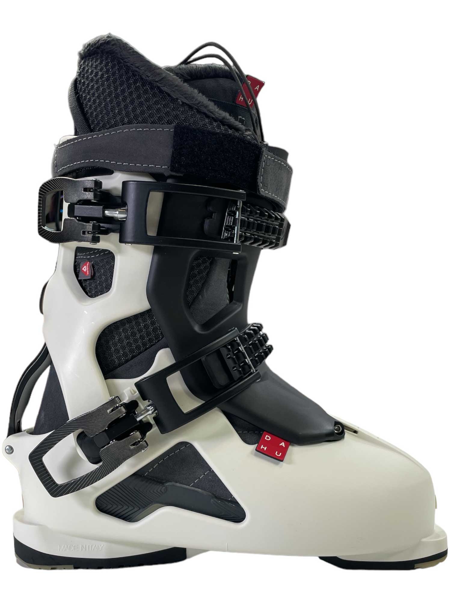 The Dahu Womens Ecorce 01 W90 Flex Ski Boot is a modern all-mountain boot with a white Grilamid shell, black adjustable buckles and cuff, plus a padded liner for secure foot and ankle support while skiing.
