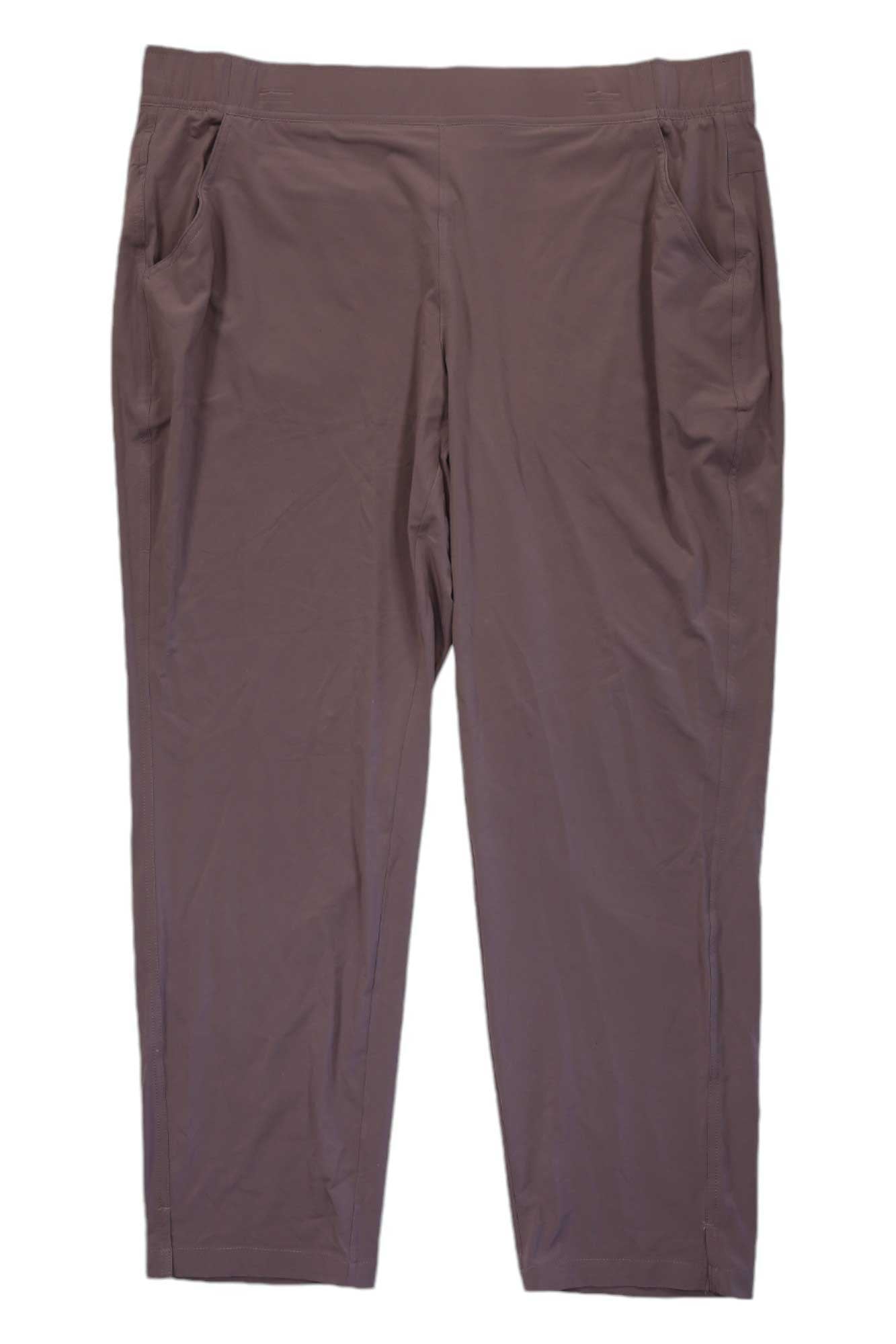 The Eddie Bauer Womens Departure Ankle Pant in taupe features an elastic waistband, side pockets, and moisture-wicking fabric, shown laid flat on a white background.