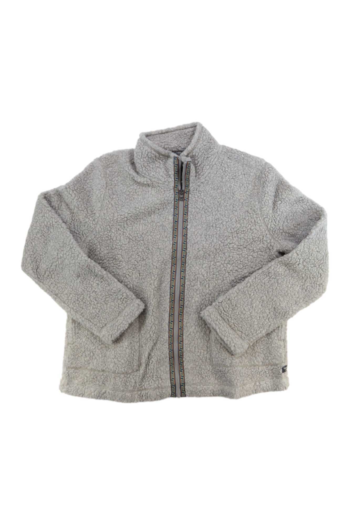 The Toad & Co Womens Sespe Sherpa Zip Jacket features light gray sherpa fabric, a stand collar, full front zip with decorative trim, long sleeves, front pockets, and cozy comfort for cooler days.