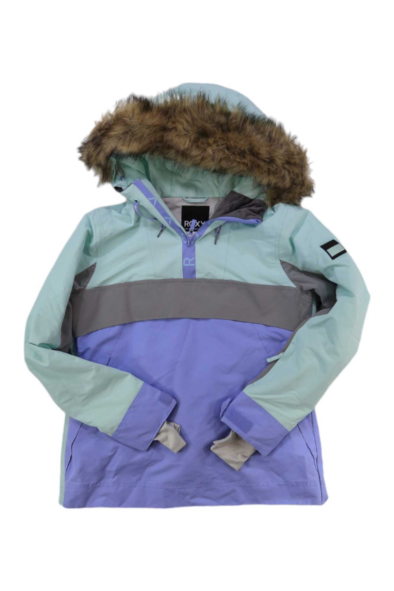 The Roxy Womens Shelter Jacket is a waterproof snowboard jacket featuring eco-friendly insulation, a light blue and lavender color block design, gray chest stripe, brown faux fur trimmed hood, and a small patch on the left sleeve.