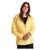 A woman with long brown hair models the Barbour Womens Leeward Jacket in yellow over a dark shirt, standing against a white background and gazing slightly to the side with a relaxed expression.