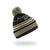 The Spyder Boys Mini Icebox Hat is a black winter hat with yellow, white, and gray stripes, a pom-pom on top, cozy fleece lining, zigzag patterning, and "SPORT" partially visible. The hat floats against a white background.