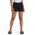 Person wearing a white T-shirt, The North Face Girls' Camp Fleece 3 Inch Short in black, and black slide sandals with white branding, standing against a plain white background.