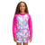 A young girl with curly hair smiles against a white background, wearing The North Face Girls Printed Amphibious LS Sun Tee—a pink and multicolored long-sleeve rash guard with UPF 50+ sun protection.