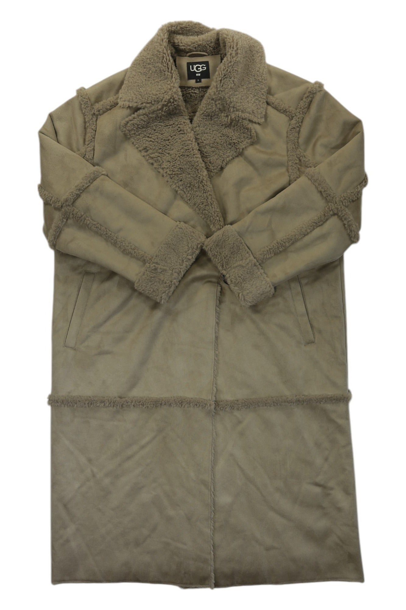 The Ugg Womens Takara Long Faux Twinface Coat is a tan outdoor jacket with a wide, fuzzy collar and cuffs, visible seam details, and two side pockets.