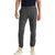 A person wears Icebreaker Men's Shifter Pant in dark gray, a black shirt, and beige high-top sneakers, standing facing forward with hands relaxed at their sides against a plain white background.