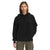 A person stands facing forward in The North Face Women's Dunraven Pullover Hoodie, one hand in their pocket and wearing olive green pants, set against a plain white background.