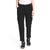 A woman in The North Face Women's Heritage Cargo Pant, black and white sneakers, and a white top stands with hands in pockets against a plain white background.