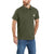 A man in a Carhartt Mens Force Cotton Delmont Pocket Polo and blue jeans stands with one hand in his pocket against a white background.