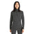 A woman with long dark hair wears the Icebreaker Women's 250 Vertex Half Zip Alpine Geo LS Top, featuring a black and white pattern and odor-resistant fabric, standing against a plain white background.