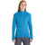 A person with long straight hair wears the bright blue Icebreaker Men's Quantum III LS Zip Jacket made from odor-resistant Merino wool, paired with gray pants, and stands against a plain white background.