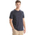 A young man faces forward wearing the Icebreaker Men's Wave SS Stripe Tee in navy with light blue and white stripes, paired with beige pants, against a plain white background.