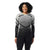 A woman smiles against a white background, wearing the Smartwool Womens Intraknit Thermal Merino Base Layer Pattern Crew in black and gray with matching black leggings.