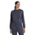A woman wearing the Icebreaker Womens Merino Crush II LS Hoodie in dark blue stands against a white background, looking slightly to the side with a relaxed expression.