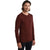 A man with long brown hair stands turned slightly right, wearing the Icebreaker Mens 200 Oasis LS Crewe Top in maroon and black pants against a plain white background.