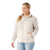 A blonde-haired woman in a ponytail smiles and looks right while wearing the Smartwool Women’s Hudson Trail Fleece Jacket, made from recycled wool fleece with pockets, paired with light blue jeans.