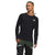 A person with braided hair models The North Face Mens FD Pro 160 Crew in black with long sleeves and FlashDry-Pro technology, paired with black-and-green pants with white accents, standing against a plain white background.