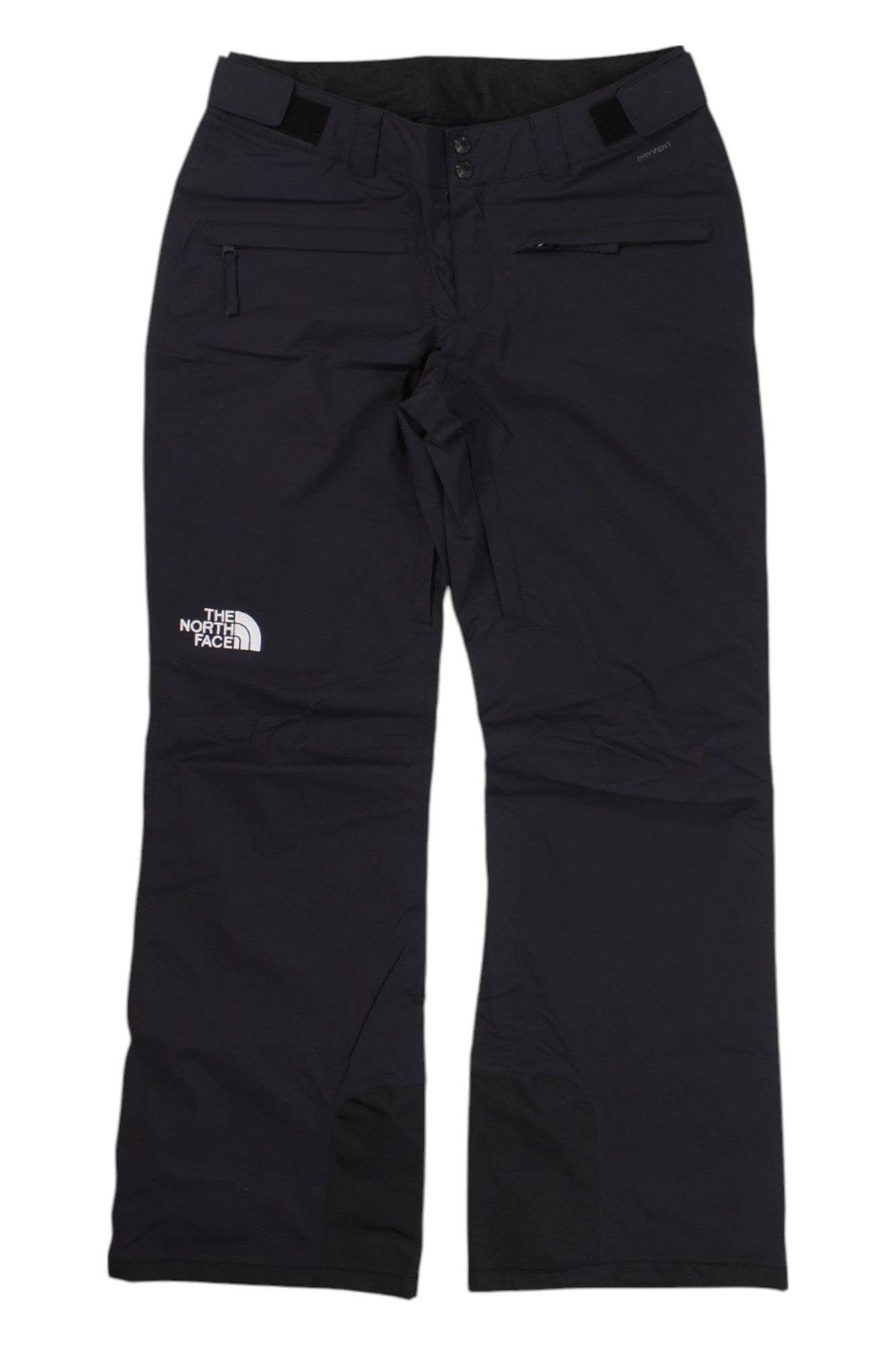 The North Face Womens Freedom Stretch Pant in black features articulated knees, a zip pocket on the right thigh, button and zip closure, reinforced cuffs, and a white logo printed on the left thigh.