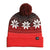 The North Face Ski Tuke is a red winter beanie with a folded brim, white snowflake and geometric patterns, a large pom-pom, and a small black logo tag for added style.