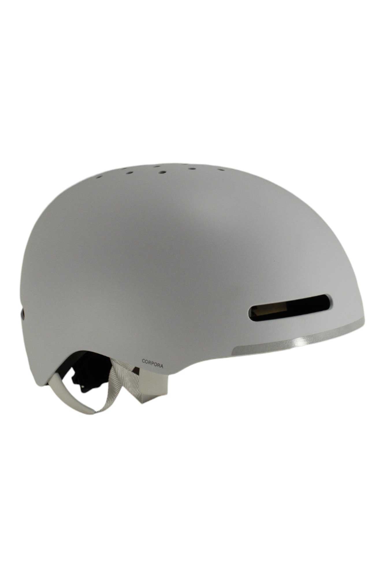 The POC Sports Corpora Helmet in matte gray has an ABS shell, top ventilation holes, directional airflow, an adjustable chin strap, and a rectangular front vent.