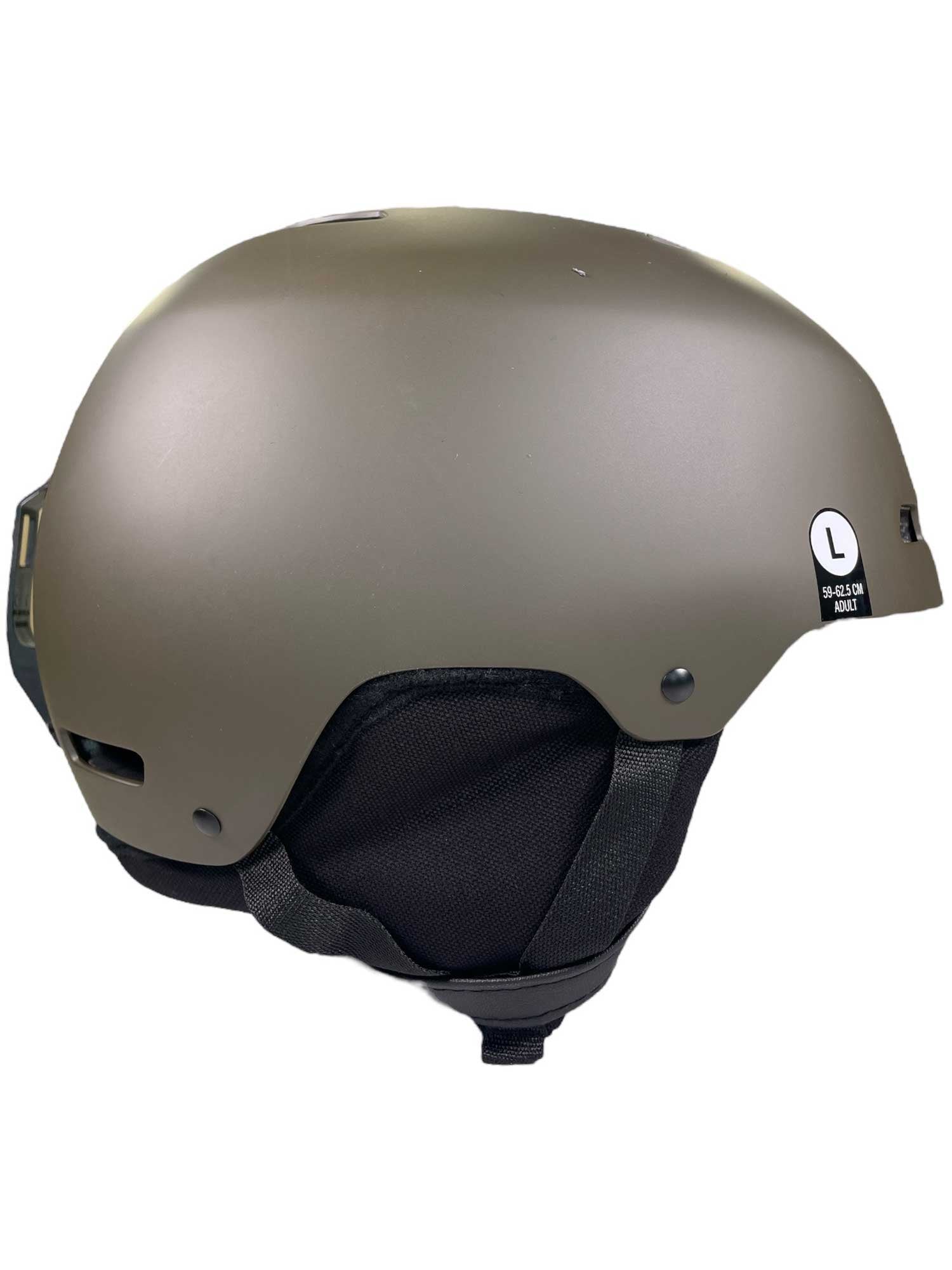 Matte olive green Giro 16 M Ledge Mips snow helmet with black adjustable strap and padded ear covers, side view. White L size sticker near the back. Ideal for skiing or snowboarding.