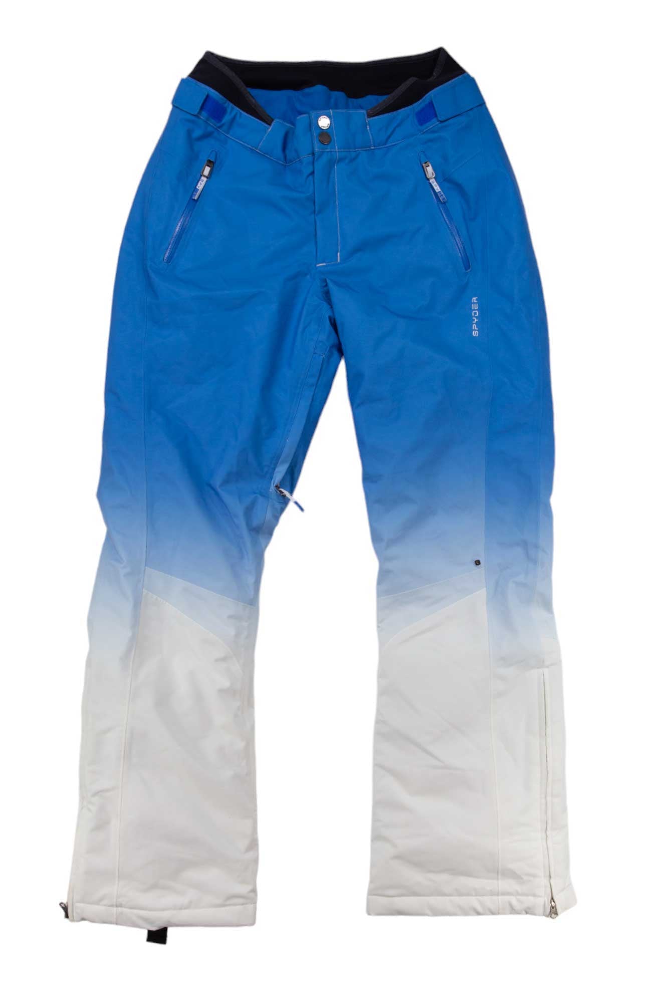The Spyder Womens Echo Pant is an insulated women’s ski pant with a blue to white ombre design, zippered pockets, belt loops, and reinforced cuffs, displayed on a white background.