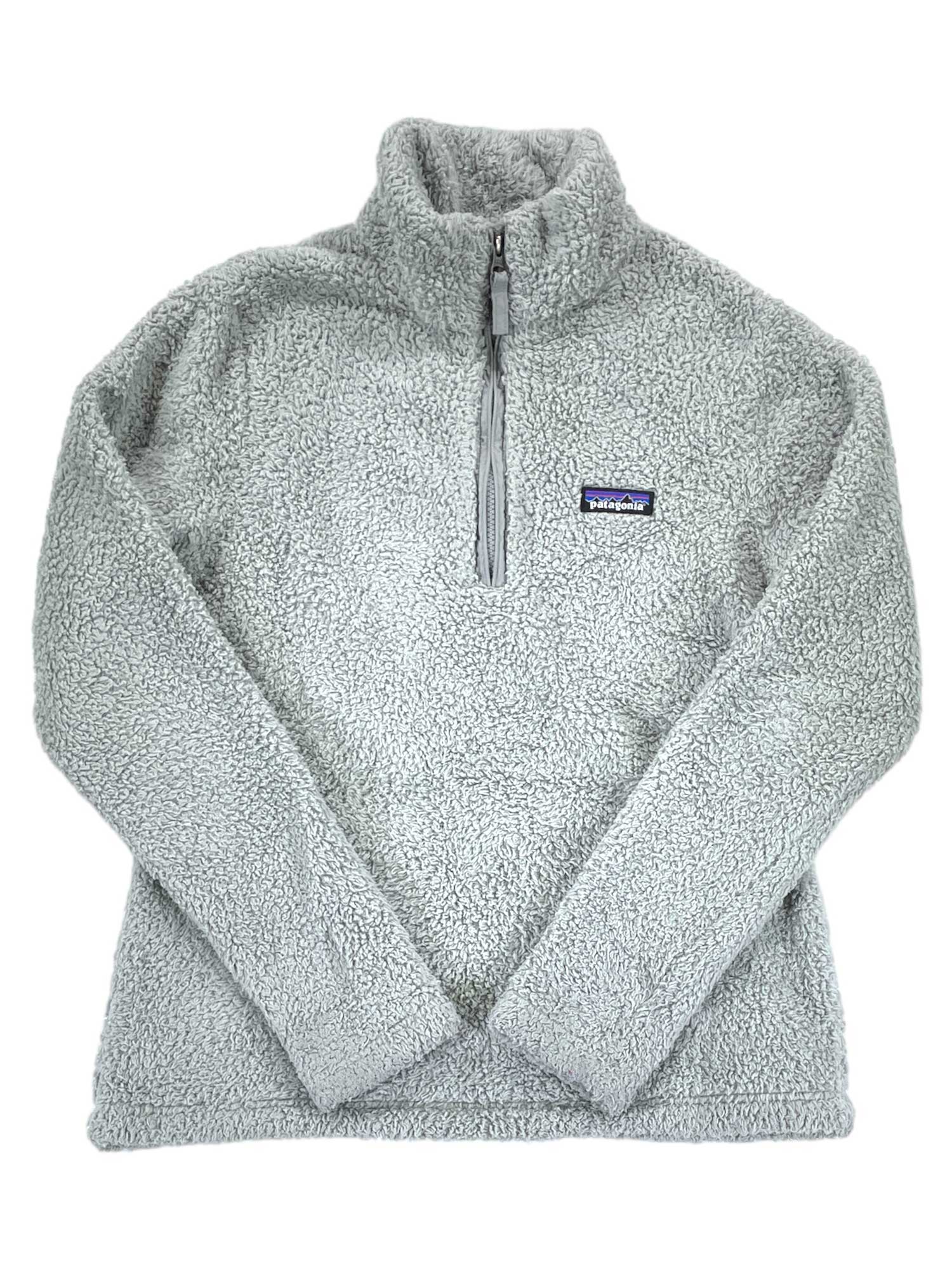 The Womens Los Gatos 1/4-Zip Fleece is a light gray, long-sleeved pullover made from soft recycled polyester fleece, featuring a quarter-zip and a small Patagonia logo patch on the left chest.