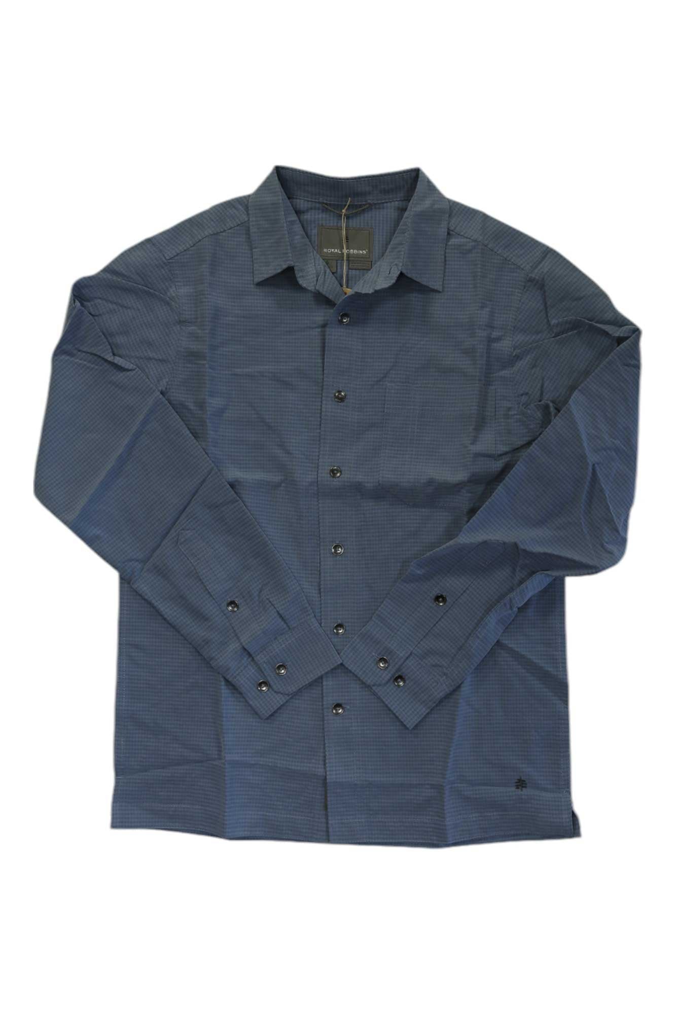 The Royal Robbins Mens Desert Pucker Dry LS Shirt, shown in dark blue checkered print with collar and buttons, is laid flat on a white background. It features quick-drying fabric and advanced thermoregulation for all-day comfort.
