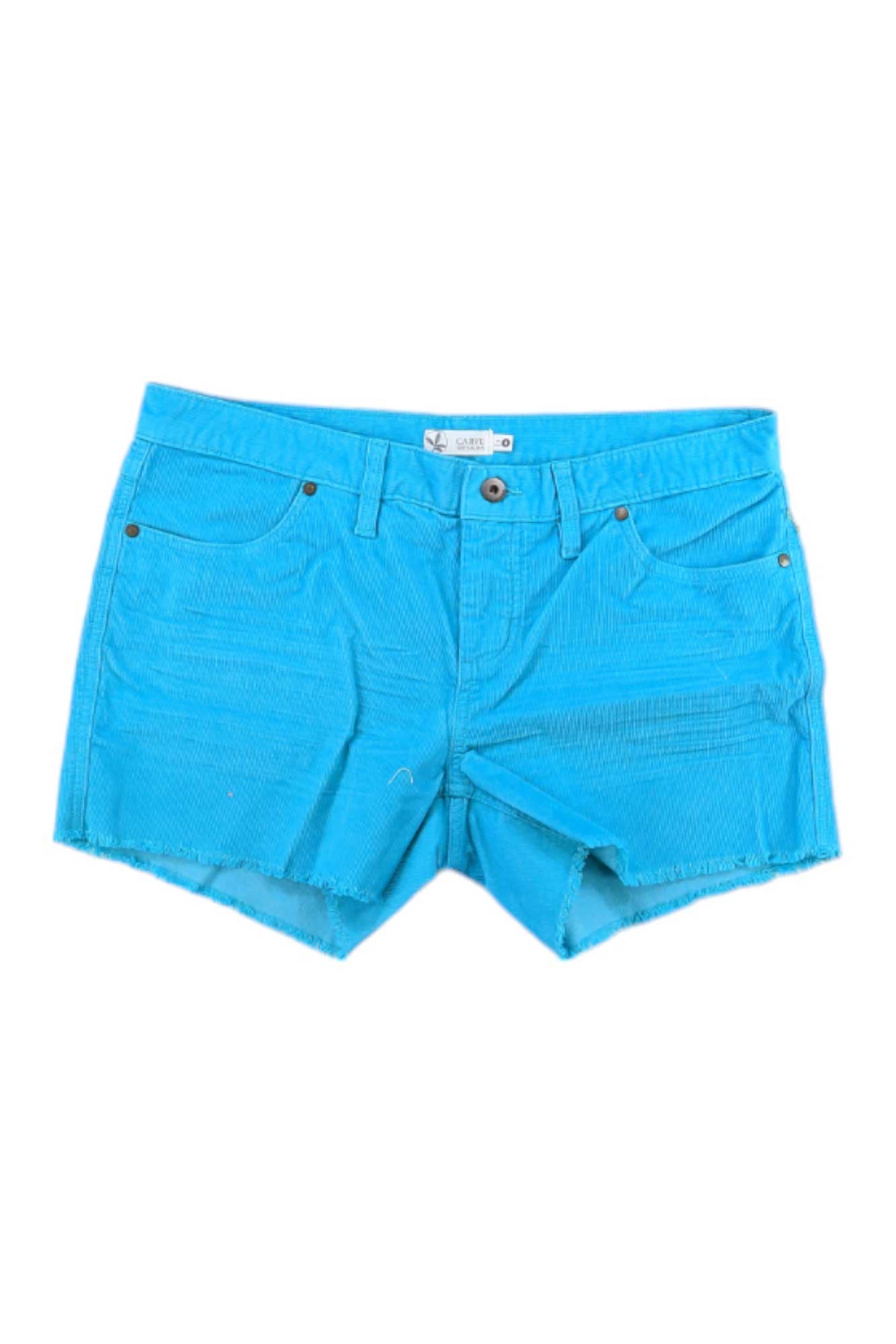 The Carve Designs Women's Oahu 4 Inch Short features a bright blue color, slim fit, front and back pockets, belt loops, button and zip closure, and raw frayed hems, shown on a white background.