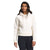 A woman wearing The North Face Womens Wool Harrison Pullover Hoodie in white with drawstrings and black pants stands against a plain background, looking slightly to her left.