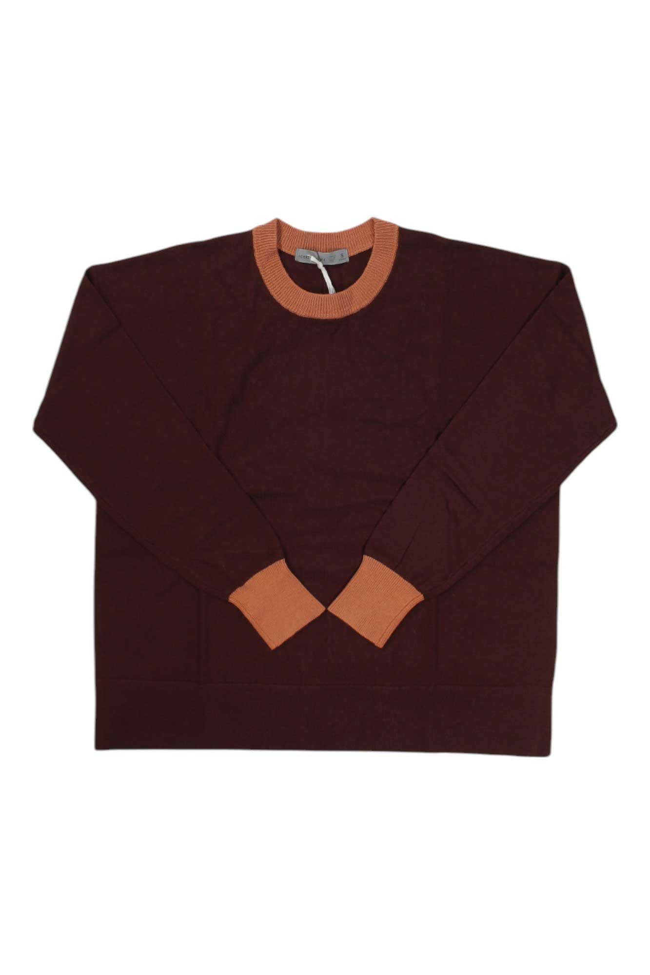 The Icebreaker Women's Shearer Crewe Sweater in dark brown merino wool with orange ribbed cuffs and an orange crew neckline is displayed flat on a white background—ideal for hiking or casual days.