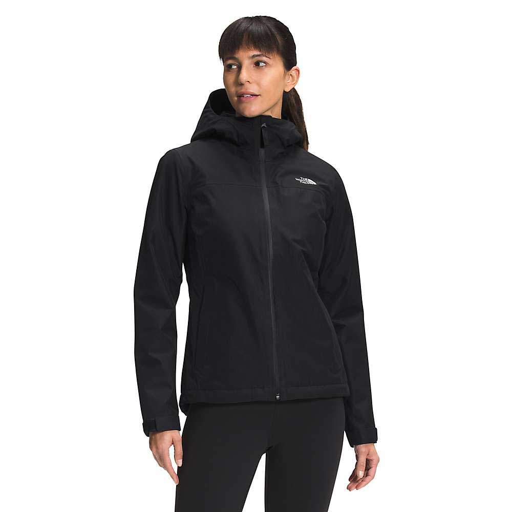 A woman models The North Face Womens Dryzzle FUTURELIGHT Insulated Jacket in black with a hood, standing slightly to the side and looking off-camera, set against a plain white background.