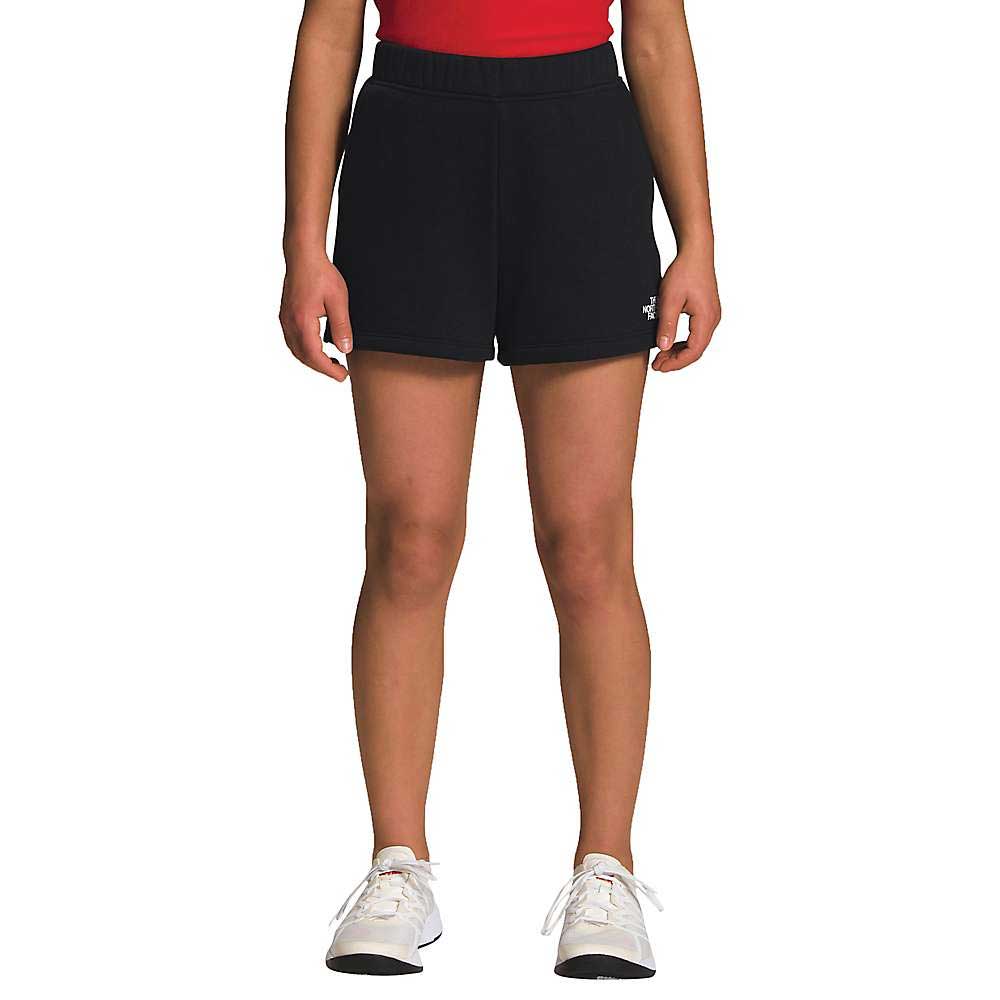 Girls black fleece shorts with elastic waistband and side pockets, above-knee cut