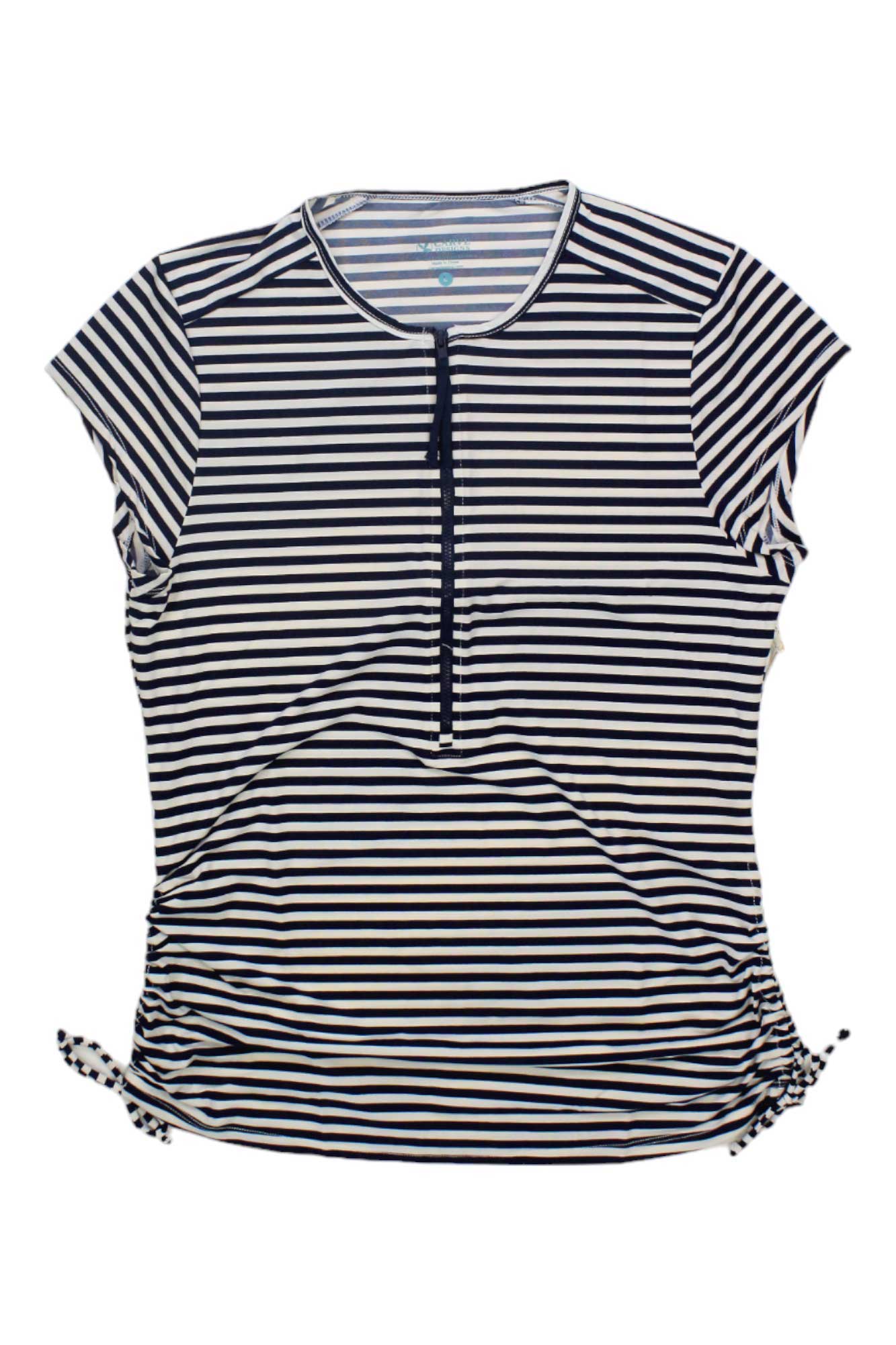 The Carve Designs Women's Dawson Rashguard is a short-sleeve, black and white striped swim shirt with a front zipper, side drawstrings at the hem, and UPF 50+ sun protection, shown flat on a white background.
