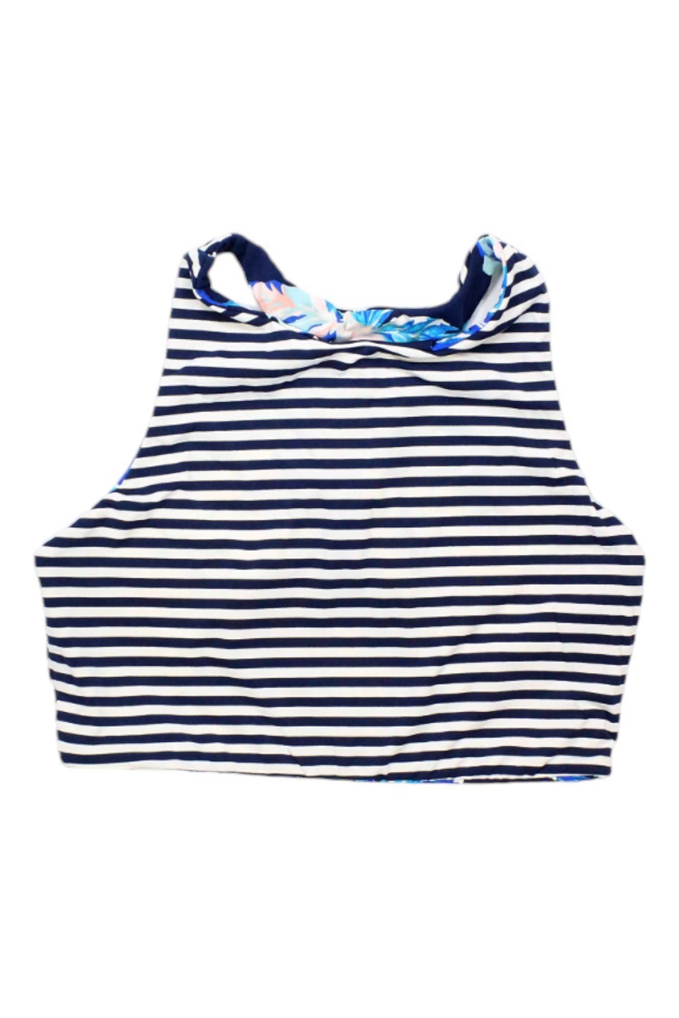 The Carve Designs Womens Sanitas Reversible Top is a sleeveless, cropped swim top with black and white stripes, a high neckline, and a blue-pink floral inner. Ideal for women's swim and surf, it offers UPF 50+ protection.