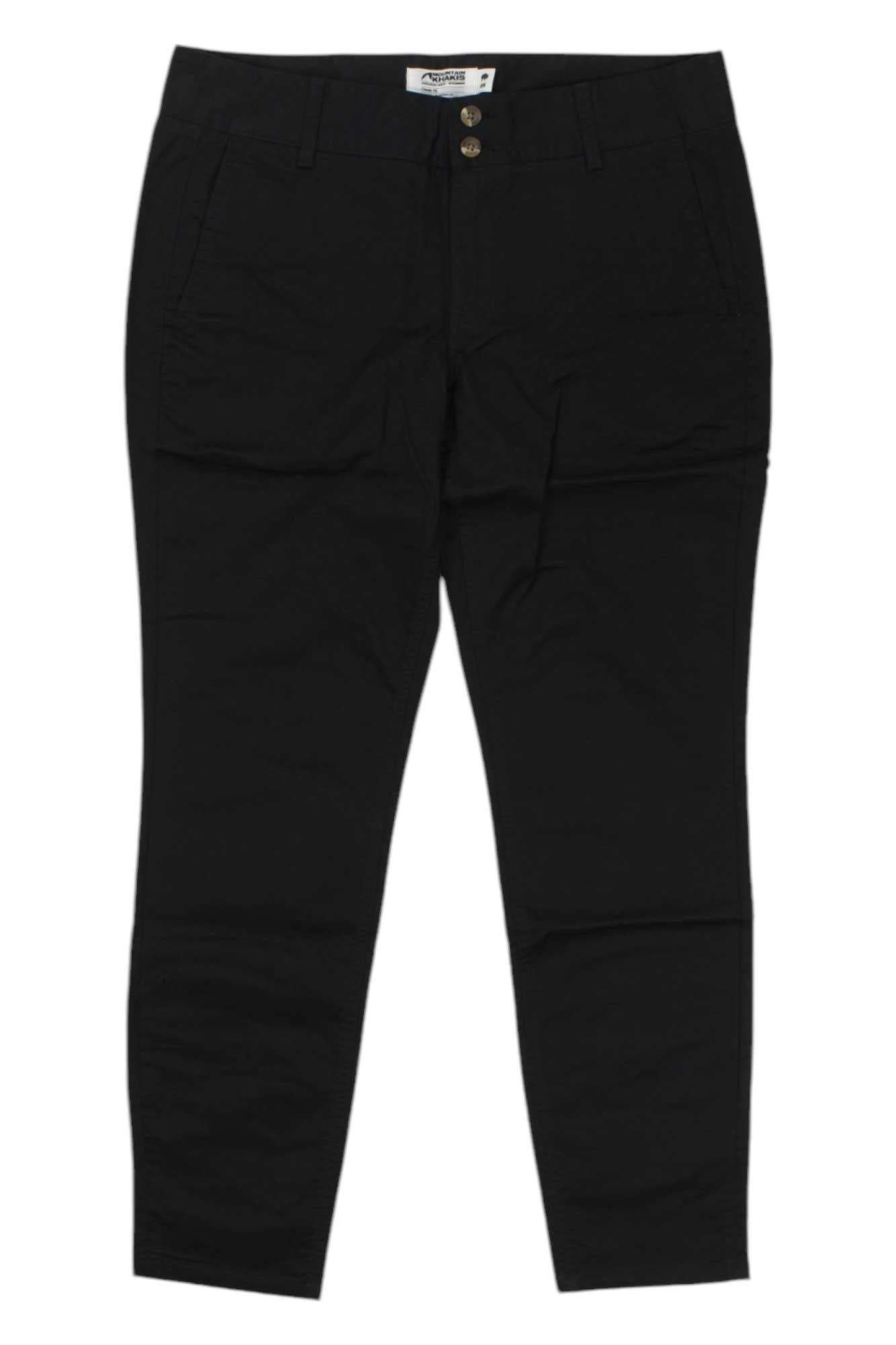 The Mountain Khakis Womens Sadie Skinny Chino Pant is a pair of black breathable stretch pants with a straight-leg cut, front pockets, belt loops, and a button and zipper closure at the waistband.