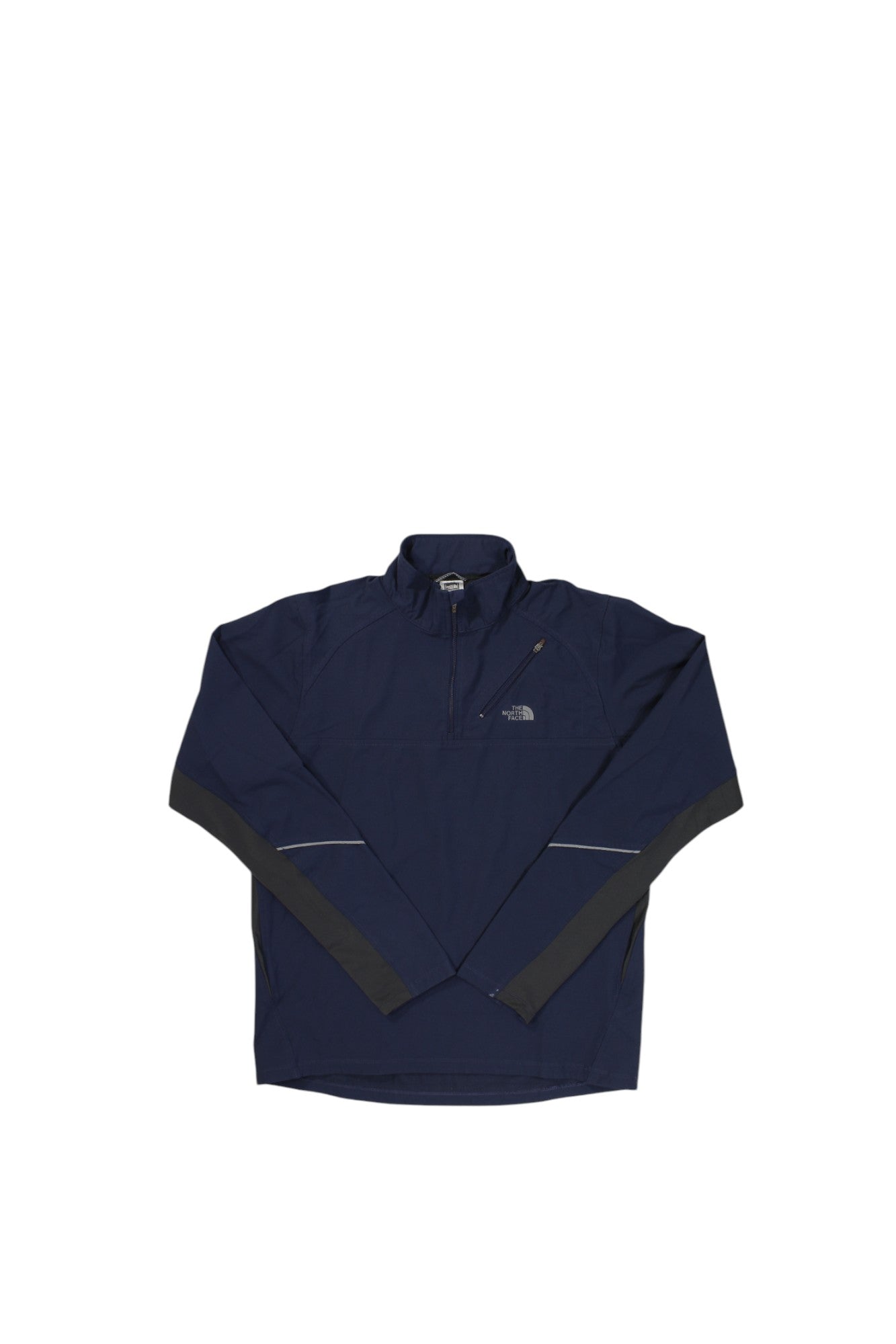 The North Face Mens Flight Series Quarter Zip in navy blue features a half-zip front, chest pocket, and dark gray sleeve accents for breathable performance, shown laid flat on a white background.
