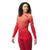 A woman with curly hair smiles against a plain white background, wearing the Smartwool Womens Intraknit Thermal Merino Base Layer Pattern Crew and matching leggings.