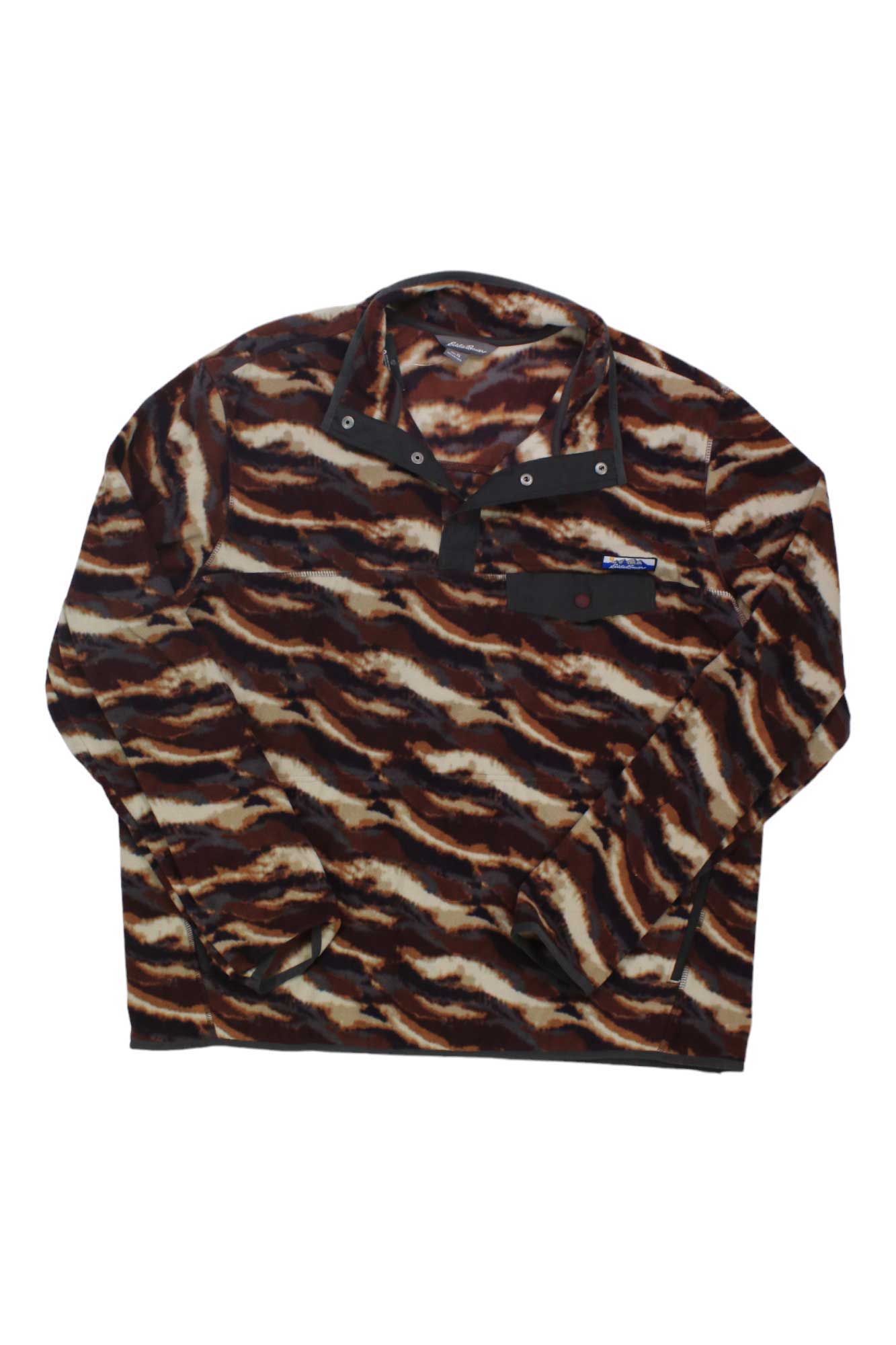 The Eddie Bauer Men's Chutes Snap Mock Top is a long-sleeve microfleece shirt featuring a brown, black, and beige abstract camo print, a snap-button collar, and a chest pocket with flap.