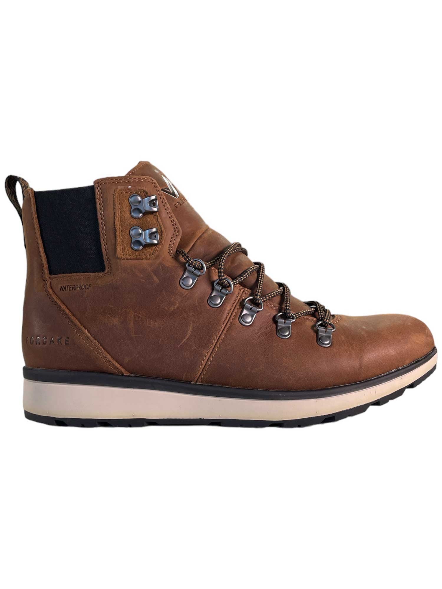 The Forsake Men's Davos High Shoe is a brown leather hiking boot with metal eyelets, black laces, padded collar, EVA midsole, and a black and white rubber sole, shown in a side view.