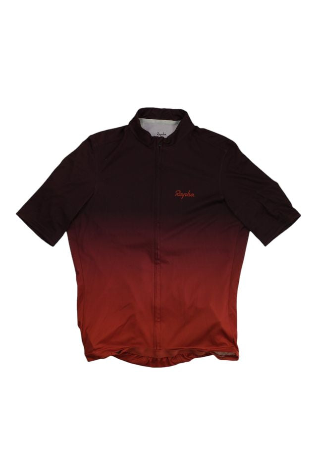 The Rapha Mens Super Lightweight Jersey is a short-sleeve cycling jersey with a front zipper, showcasing a gradient from dark burgundy to deep red, and the Rapha logo embroidered on the left chest.