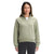 A woman faces forward, wearing The North Face Women's Longs Peak Quilted 1/4 Zip Jacket in light green with black pants, set against a plain white background.