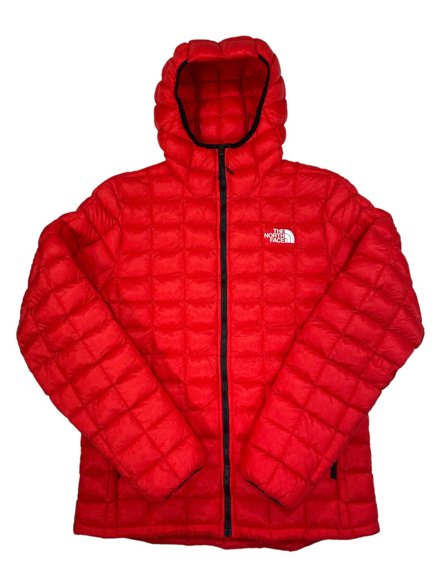 The Mens Circuit Fleece is a bright red, quilted hooded jacket with a black zipper and a white The North Face logo on the left chest. Perfect for outdoor adventures, this puffy fleece is shown against a white background.